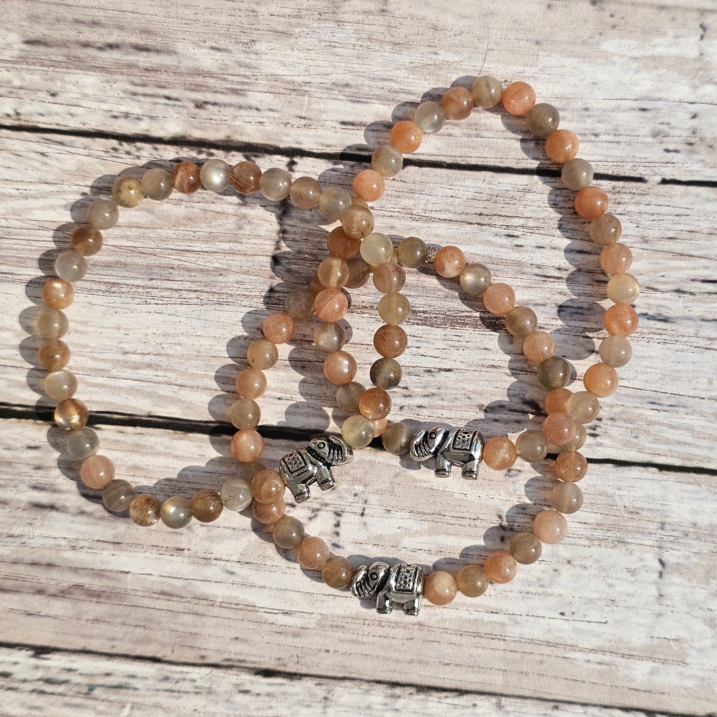 5mm Reiki Infused Skeletal Sunstone Bracelet with Elephant Charm