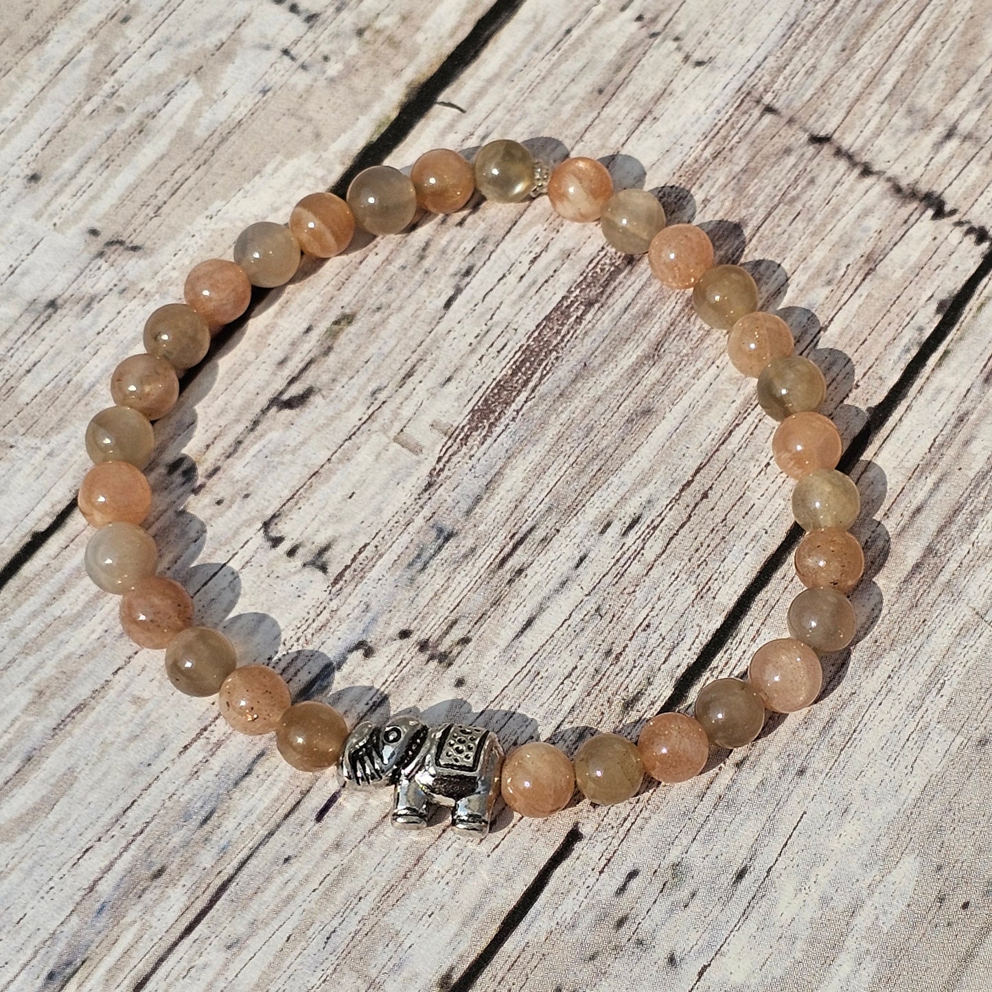 5mm Reiki Infused Skeletal Sunstone Bracelet with Elephant Charm