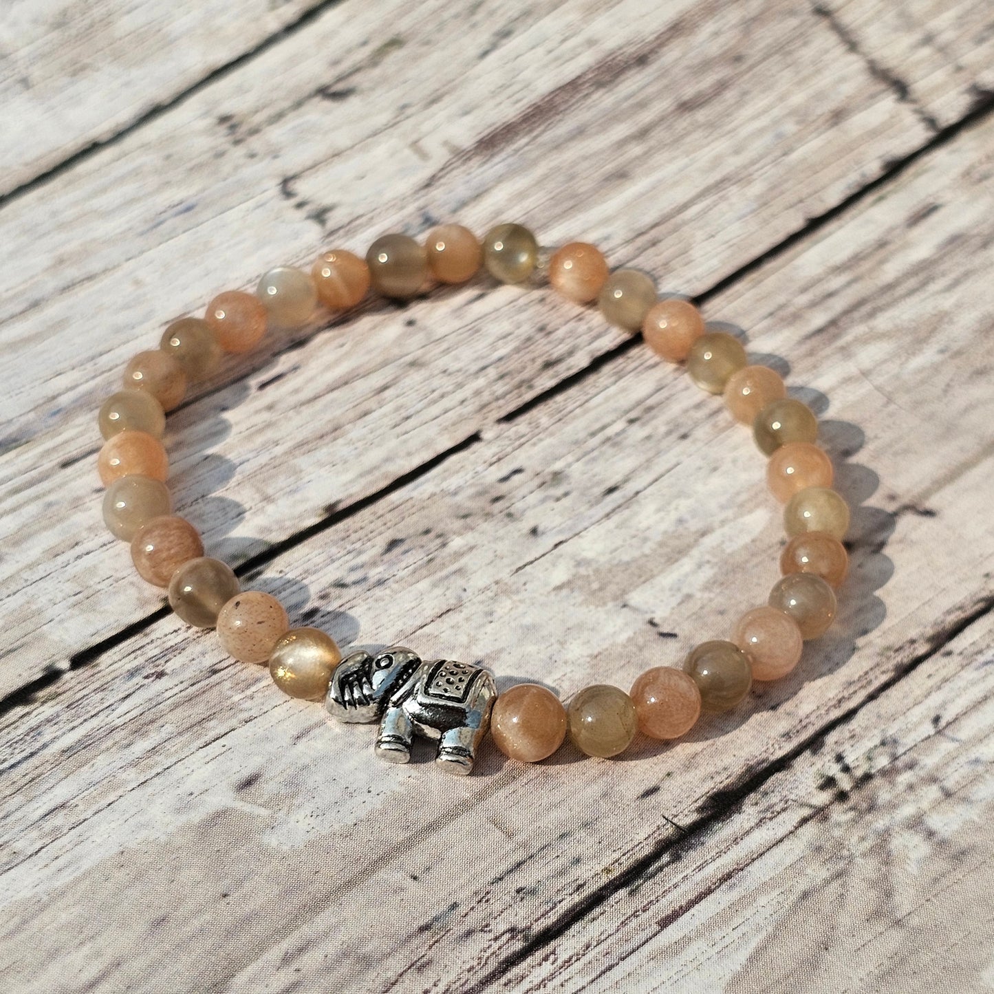 5mm Reiki Infused Skeletal Sunstone Bracelet with Elephant Charm